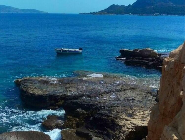 The Greek island that has no sandy beaches.